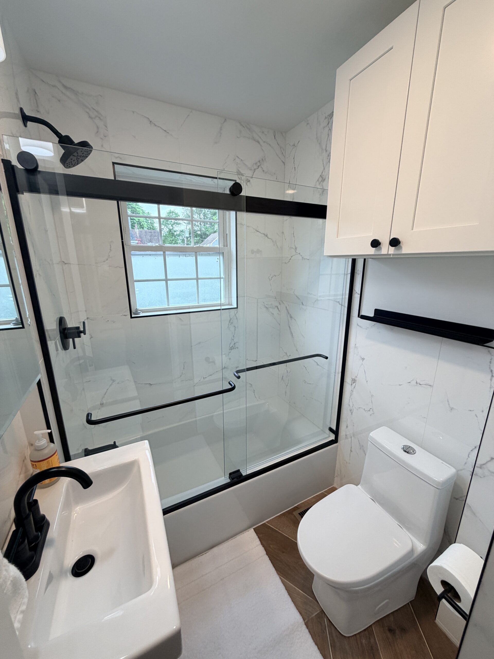Natick bathroom renovation overhead view - tub shower combo, toilet with upper cabinet, vanity layout
